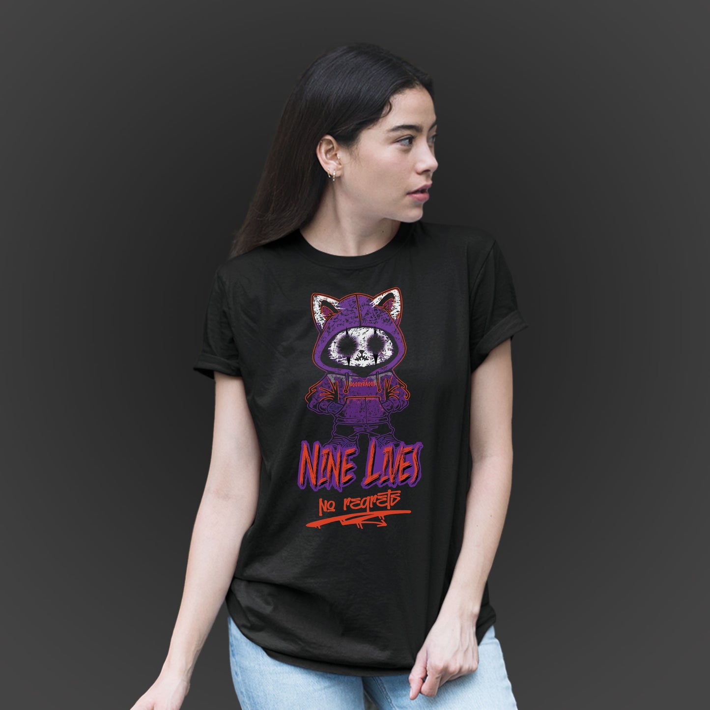 Woman Wearing A Black T-shirt With A Gothic Emo Cat Design And Text Nine Lives No Regrets