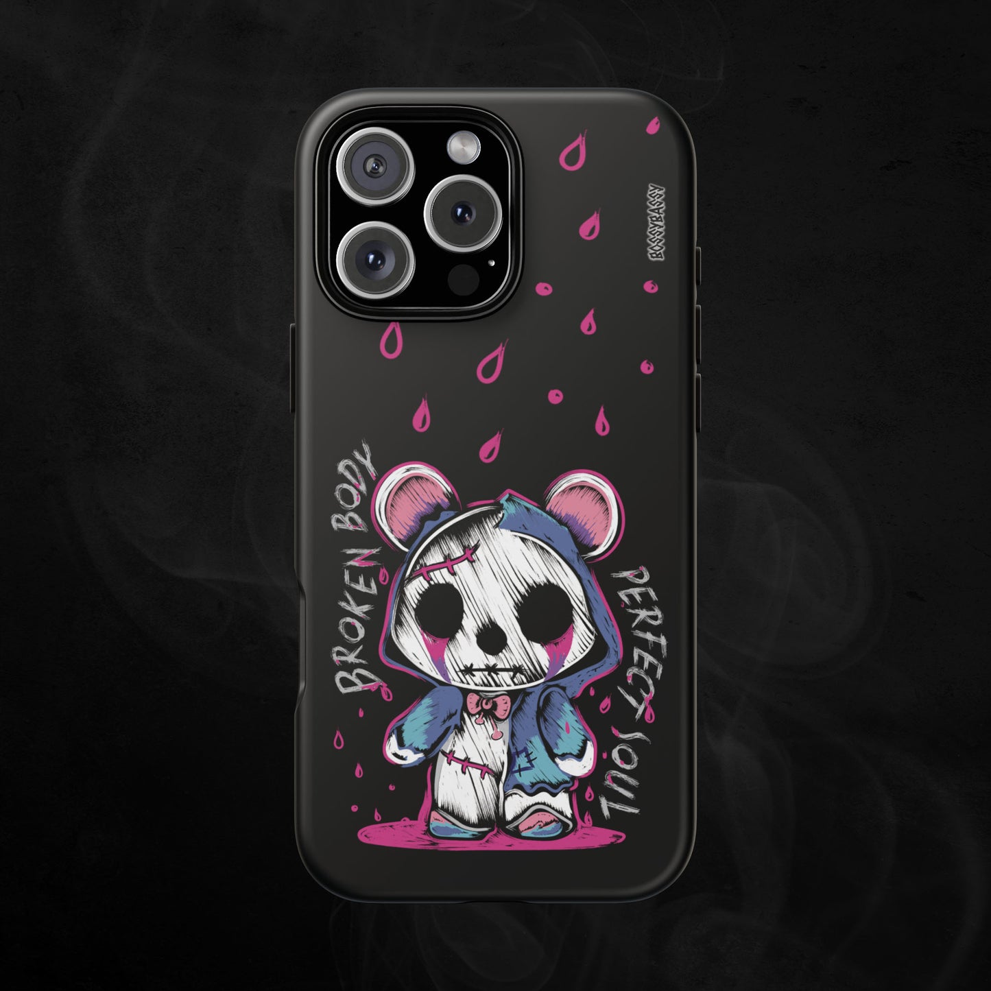 black matte phone case features a handrawn illustration of an emo-horror-bear with pink blood dropping design and text broken body perfect soul