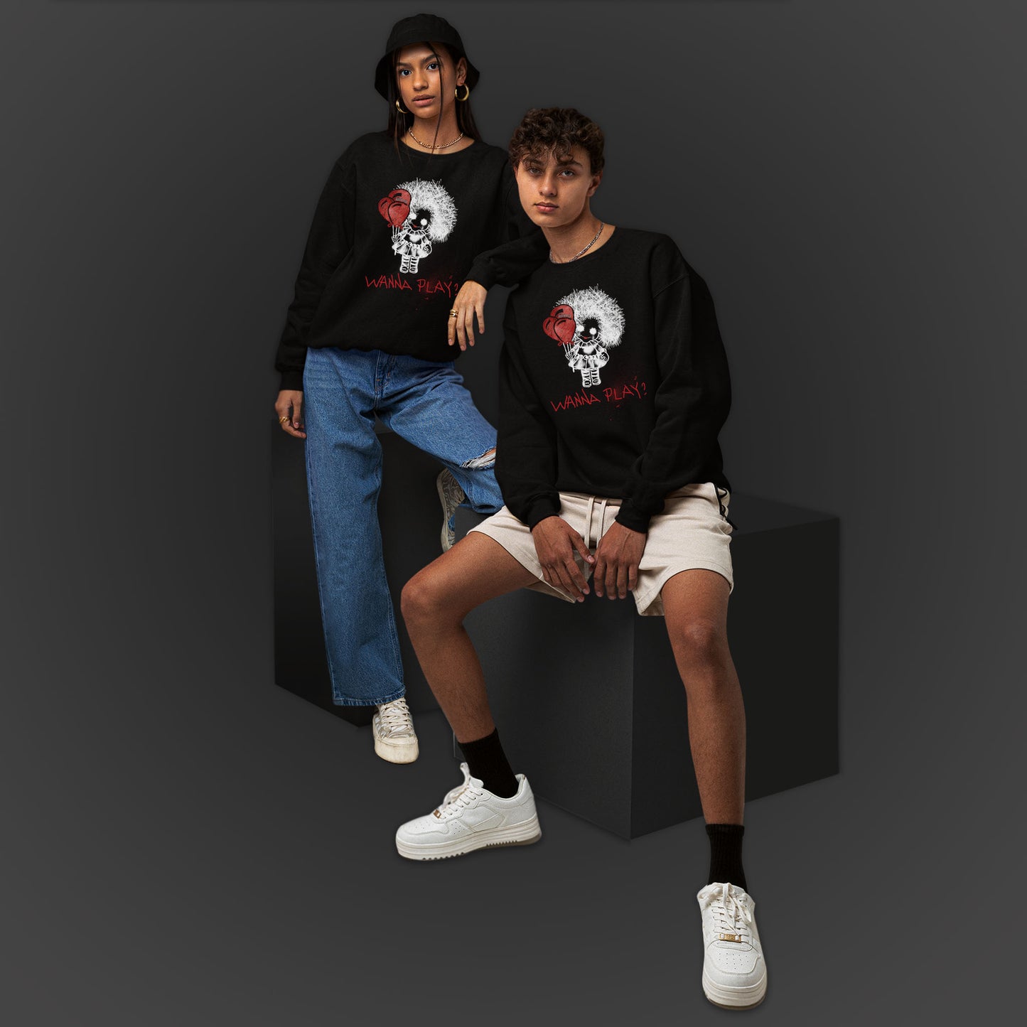 Young Couple Wearing A Black Sweatshirt With Spooky Girl Horror Design And Text Wanna Play