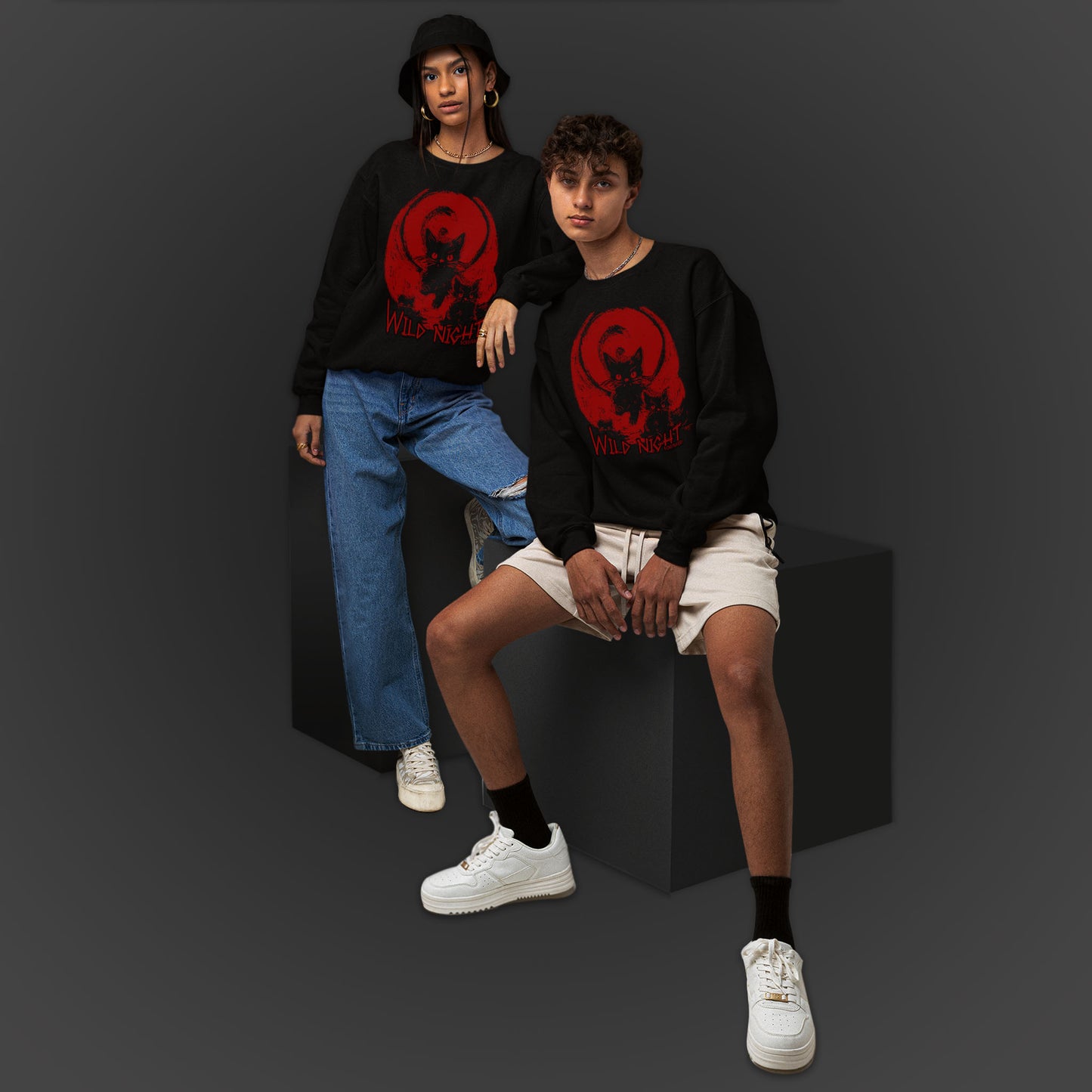 young couple wearing a black unisex sweatshirt features an illustration of black cats with a red background and the text wild night