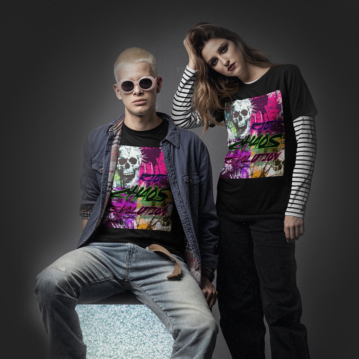 young-couple-wearing-a-black-t-shirt-with-punks-alements-design-and-text-riot-chaos-revolution