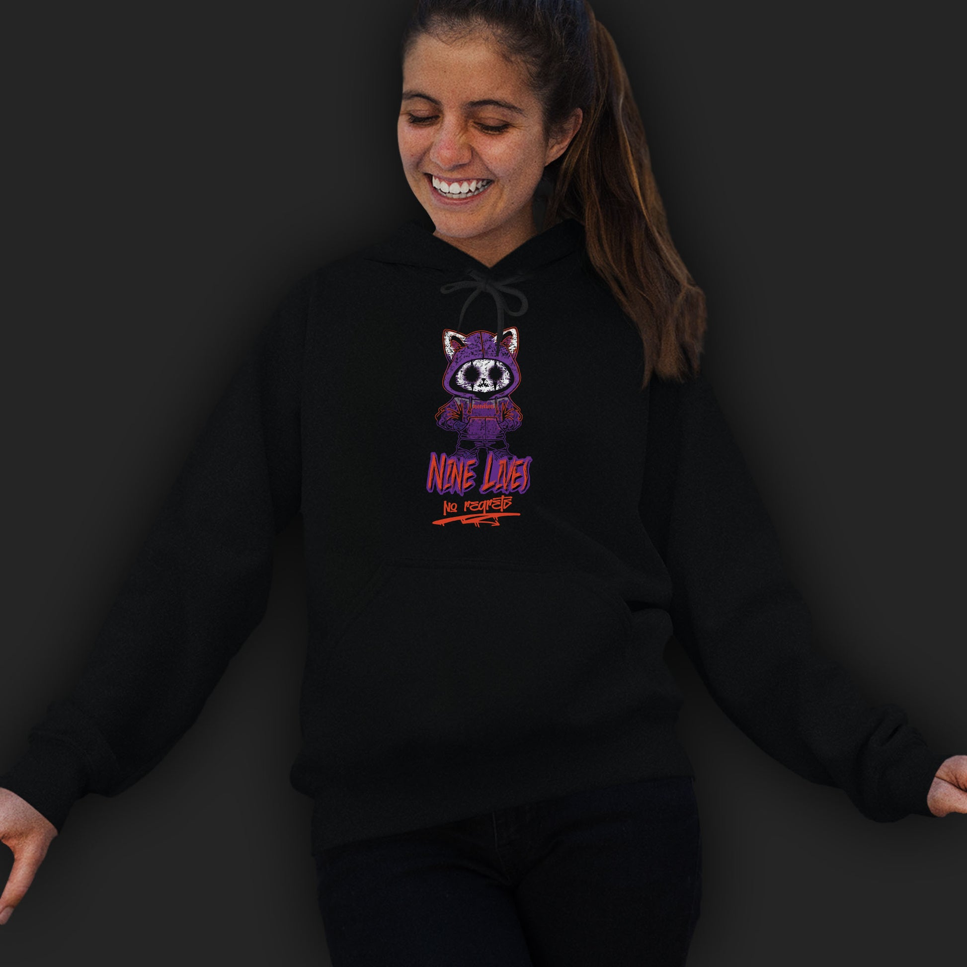 Woman Wearing A Black Hoodie With A Gothic Emo Cat Design And Text  Nine Lives No Regrets