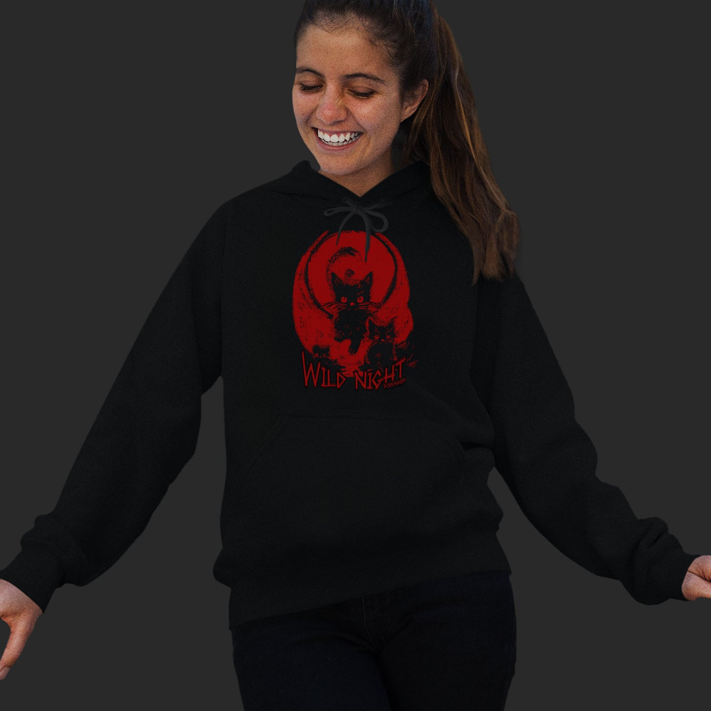 Woman Wearing A black unisex hoodie features an illustration of black cats with a red background and the text wild nights