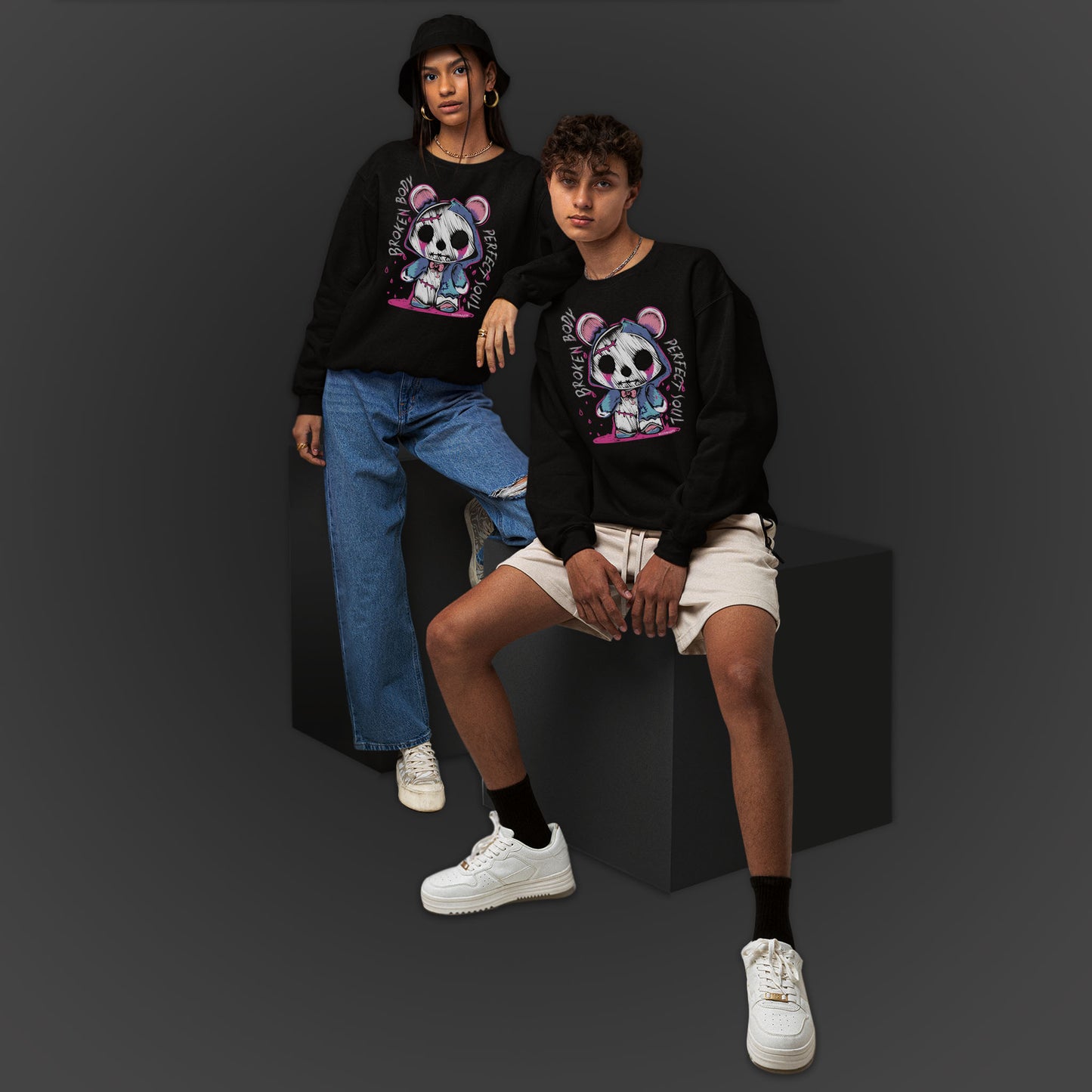Young Couple Wearing A Black Sweatshirt With A Gothic Emo Hand Drawn Bear Design With Text Broken Soul Perfect Body