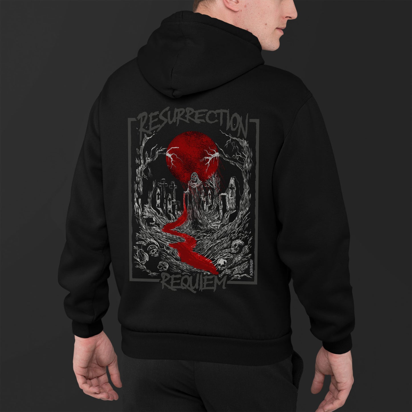 Young Man Wearing A Unisex Black Hoodie With White Graveyard And Red Moon Illustration  Design With Text Resurrection Requiem