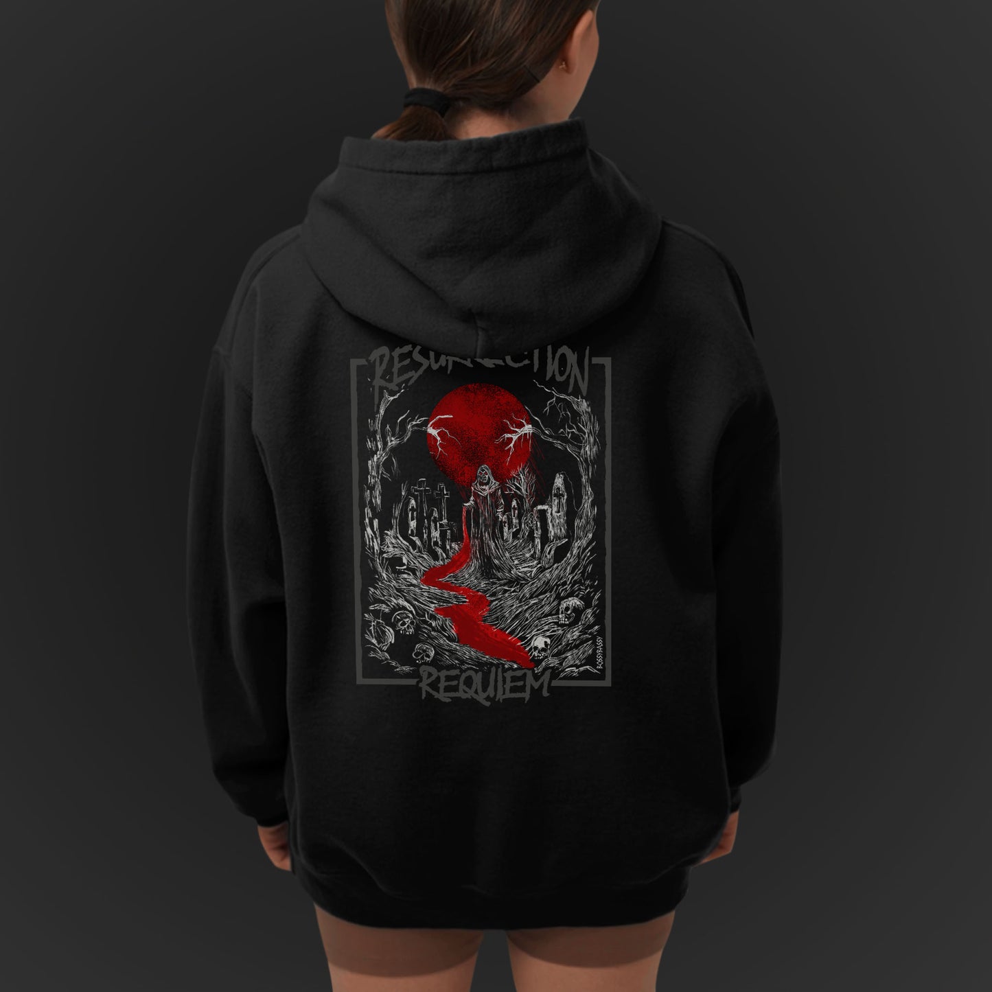 Young Woman Wearing A Unisex Black Hoodie With White Graveyard And Red Moon Illustration  Design With Text Resurrection Requiem