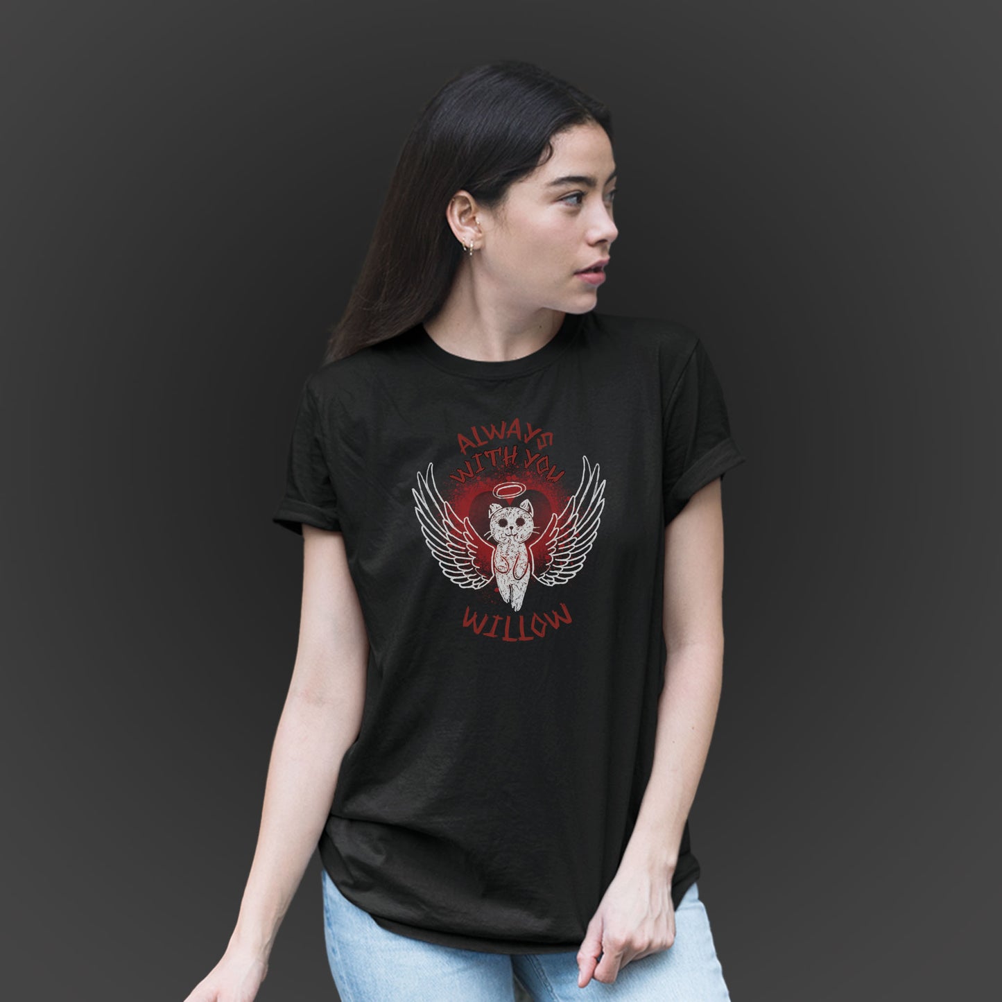 young woman wearing a black tshirt with illustration of an angel cat and the text Always With You and custom name