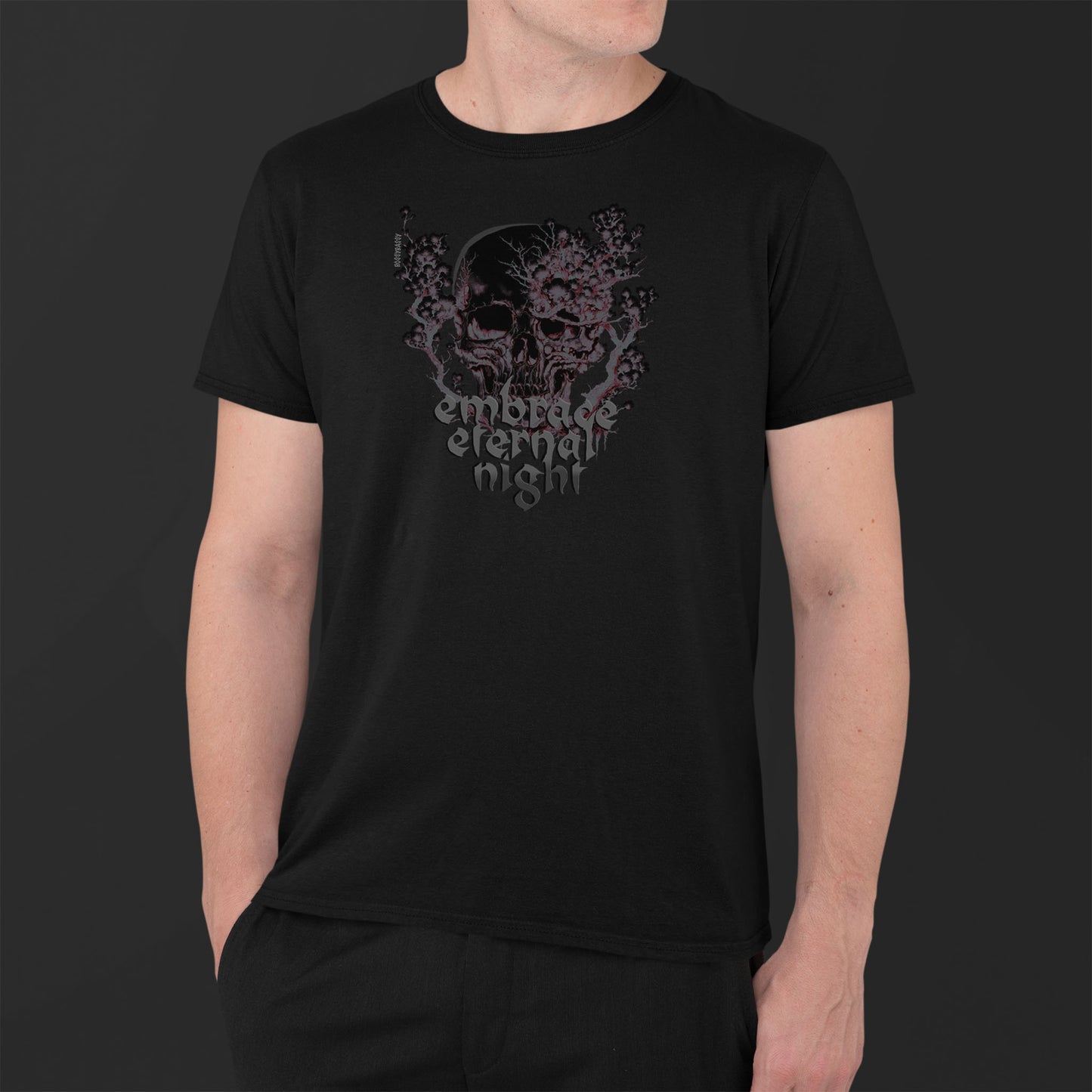 man-wearing-a-black-unisex-tshirt-with-gothic-pink-and-black-skull-print-and-text-embrace-eternal-night