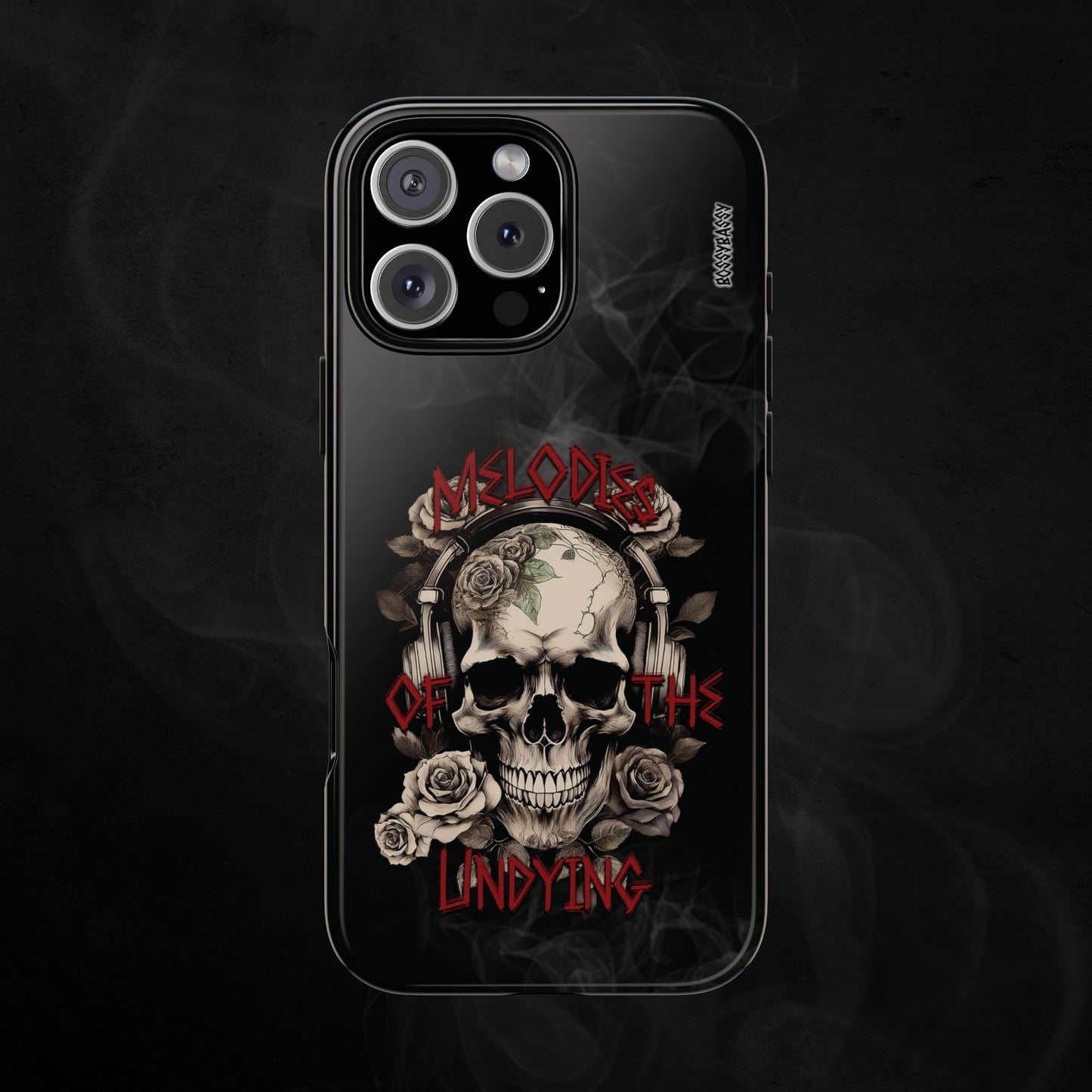 phone case glossy features an illustration of a vintage skull skeleton with roses and the text 'Melodies of the Undying