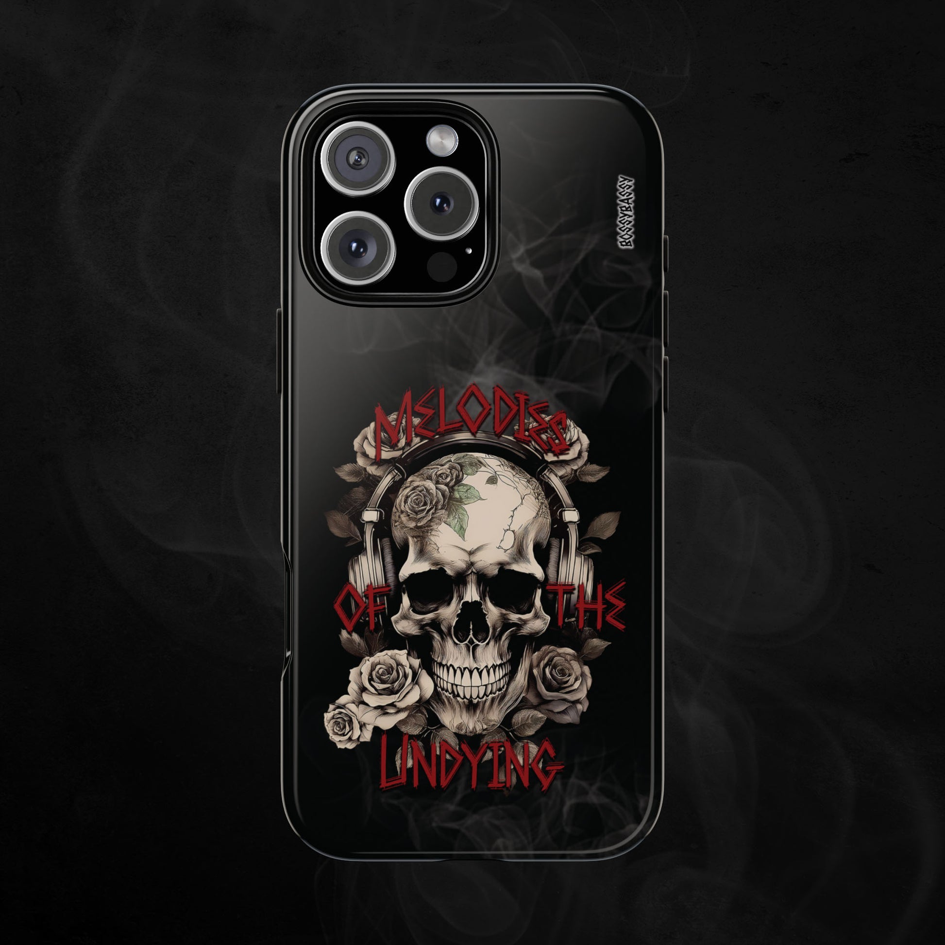 phone case glossy features an illustration of a vintage skull skeleton with roses and the text 'Melodies of the Undying