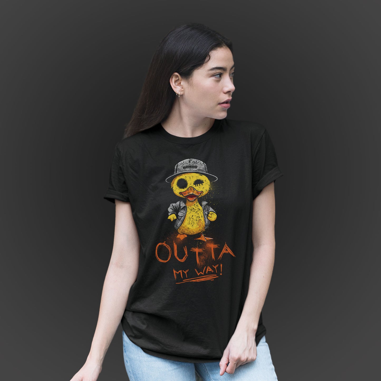 woman wearing a black t-shirt features a hand drawn illustration of a rude duck with the phrase outta my way