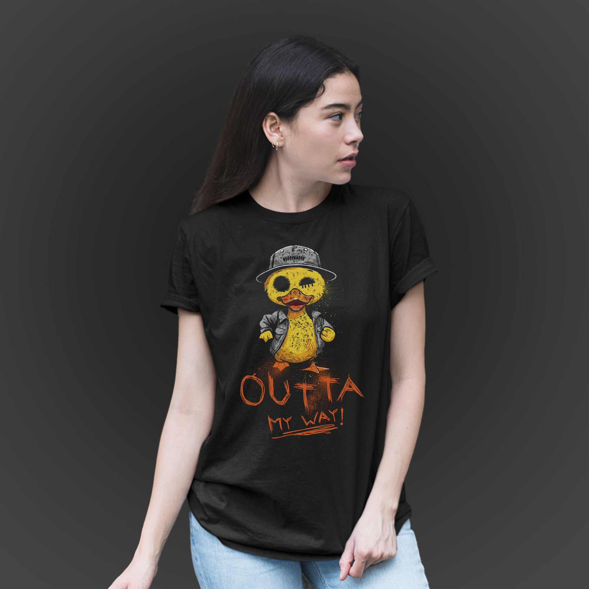 woman wearing a black t-shirt features a hand drawn illustration of a rude duck with the phrase outta my way