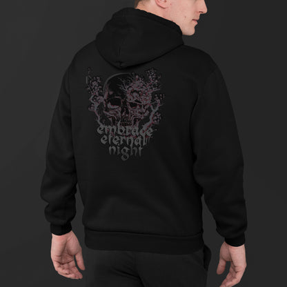 young-man-wearing-a-black-sweatshirt-with-gothic-pink-and-black-skull-print-and-text-embrace-eternal-night