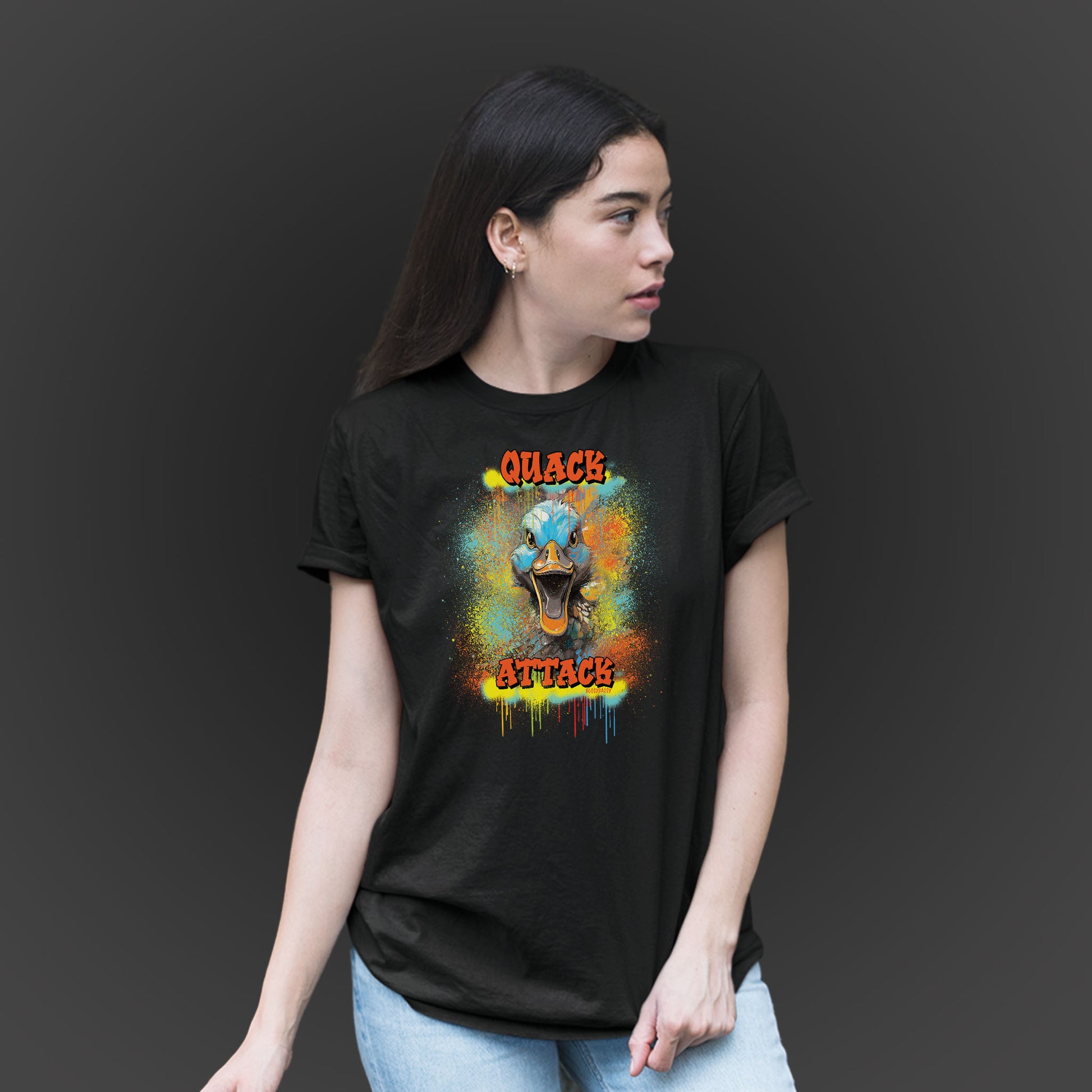 younger woman wearing a black unisex tshirt with a crazy duck and text quack attack with graffiti design